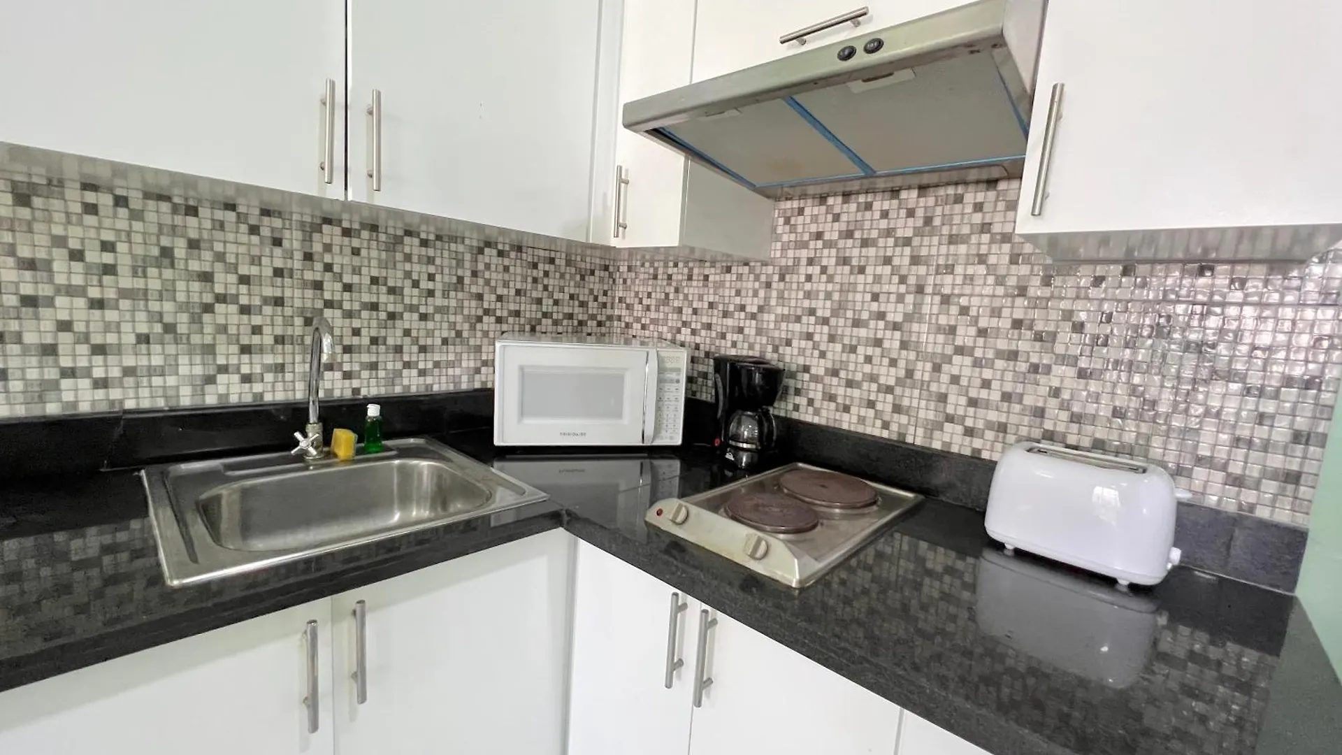 ***** Hotel apartamentowy Sunny Suites With Rooftop Pool And Spa - Playa Los Corales Punta Cana Dominikana